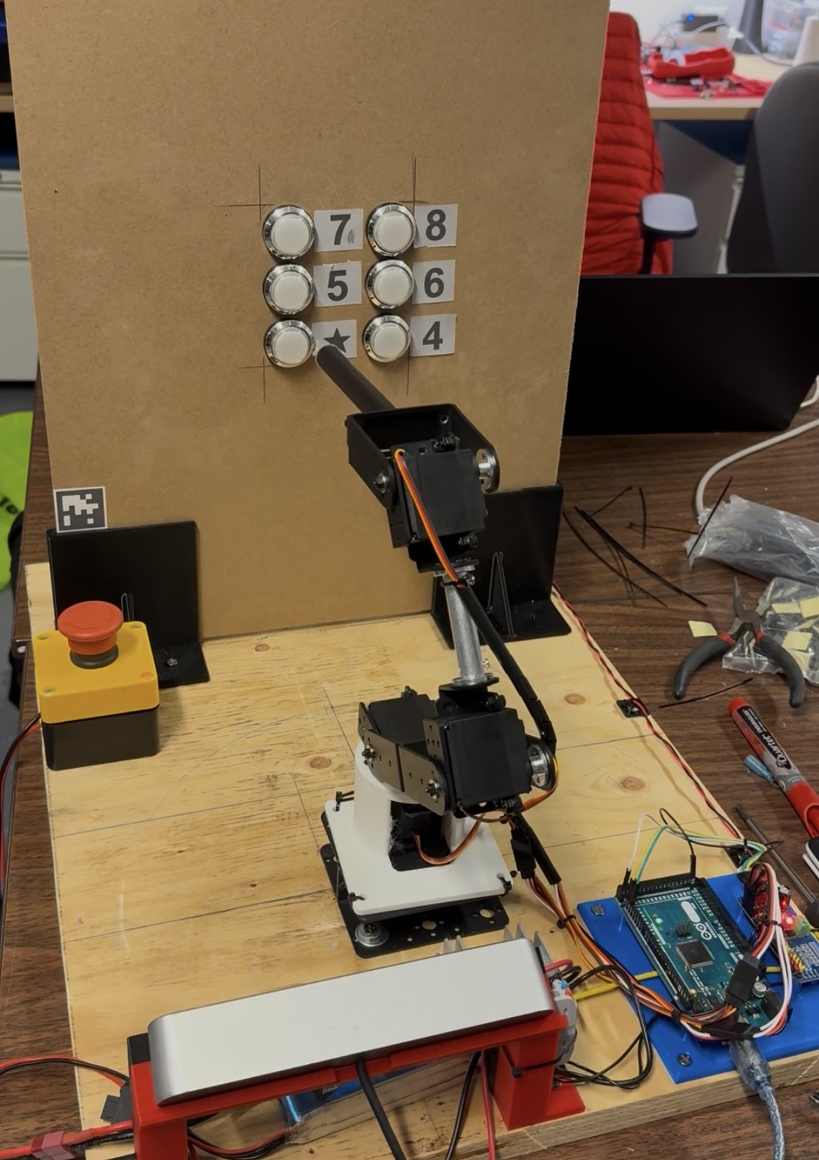 Assistive robotic arm prototype operating an elevator panel